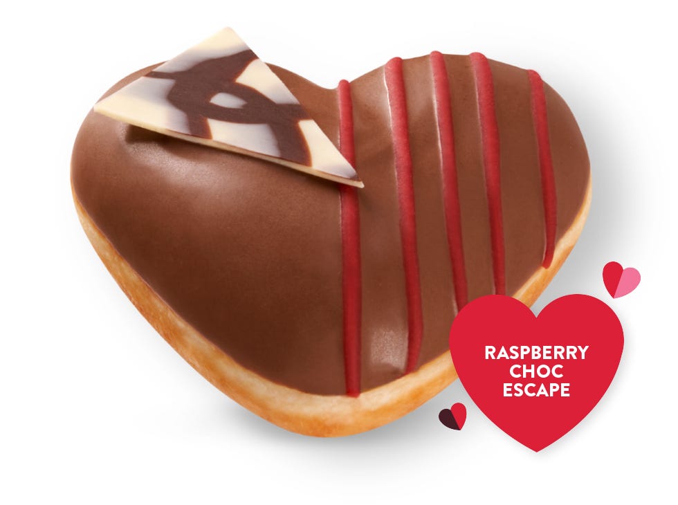 Raspberry Choc Escape Picture of Raspberry Chocolate Valentine's Day doughnut, with a chocolate cip and red raspberry drizzle on top