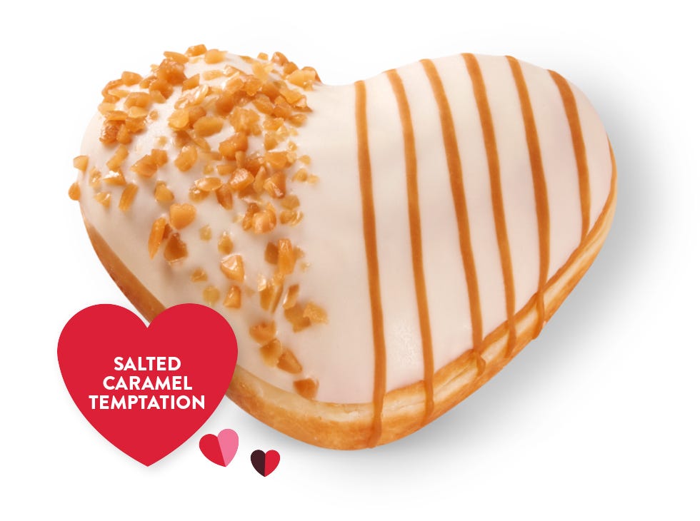 Raspberry Choc Escape Picture of Raspberry Chocolate Valentine's Day doughnut, with a chocolate cip and red raspberry drizzle on top