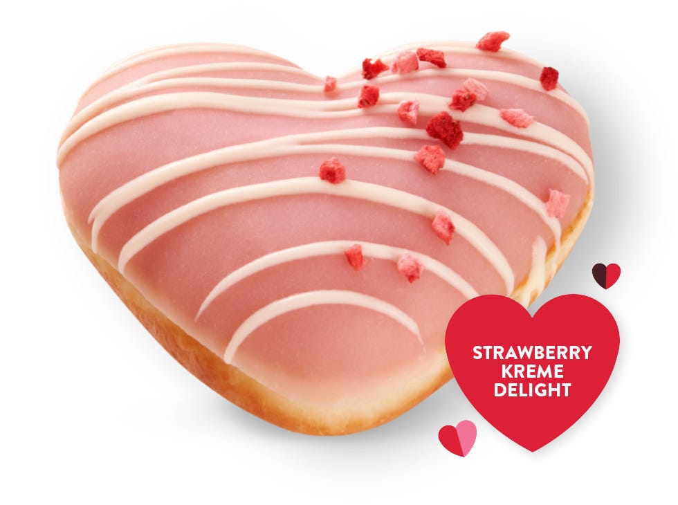 Raspberry Choc Escape Picture of Raspberry Chocolate Valentine's Day doughnut, with a chocolate cip and red raspberry drizzle on top